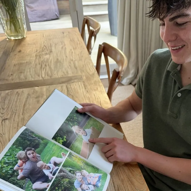 James Baxter with their Photouria baby book